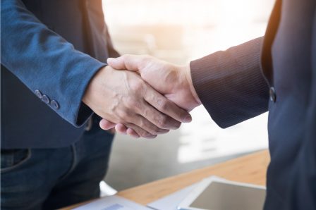 two-confident-business-man-shaking-hands-during-meeting-in-the-office-success-dealing-greeting-and-partner-concept